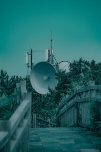 a white bridge with a satellite dish
